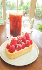 Raspberry Tart served with ice coffee, homemade dessert.