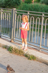 Little girl baby with tails in holiday clothes