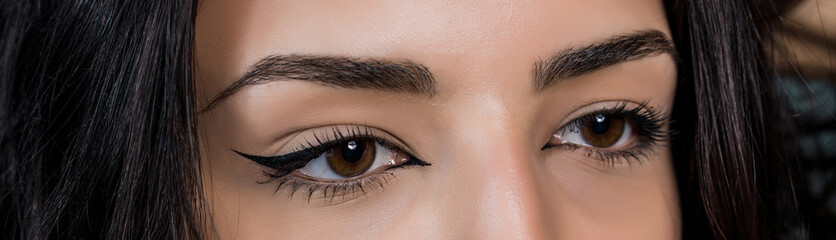 close-up photo of woman eye with eyeliner makeup   on white background.