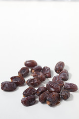 Dried dates fruits on white background, tasted sweet and chewy
