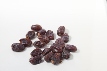Dried dates fruits on white background, tasted sweet and chewy