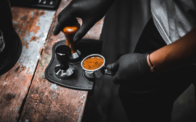 Close-up of espresso pouring from coffee manual brew. Professional coffee brewing.