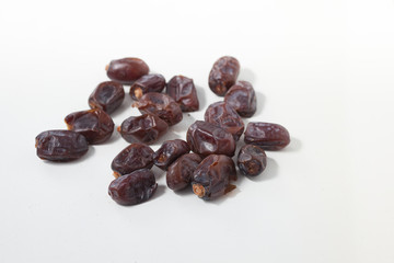 Dried dates fruits on white background, tasted sweet and chewy