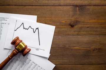 Debts - judge gavel, crisis graph - on wooden desk top-down copy space © 9dreamstudio