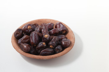 Dried dates fruits on white background, tasted sweet and chewy