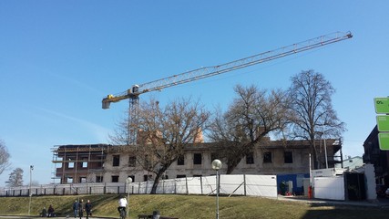 Fototapeta na wymiar Construction site on the hill with long crane