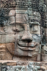Fototapeta na wymiar Close up of one of the Stone Face Towers in the Bayon Temple, Angkor Thom, Cambodia