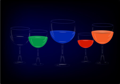 Beautiful glasses of colored drinks on blue background
