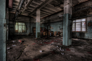 Fototapeta na wymiar Hall with columns in an abandoned factory