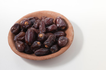 Dried dates fruits on white background, tasted sweet and chewy