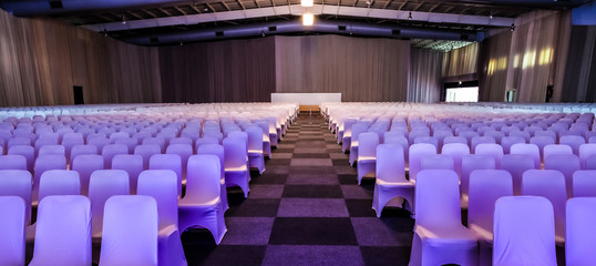 Naklejka premium empty chairs in large Conference hall for Corporate Convention or Lecture