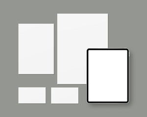 Naklejka premium Vector stationery mockup with blank paper, tablet, business cards. Branding stationery mockup scene. Mockup vector isolated. Template design. 