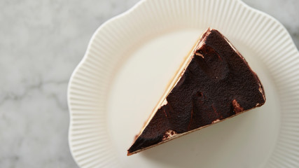 Piece of tiramisu cake on plate