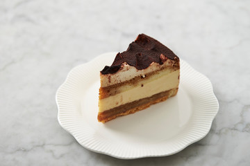 Piece of tiramisu cake on plate