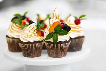 Plate with freshly baked sweet muffins. Sweet pastries, recipes, cooking