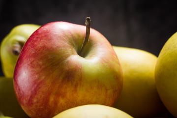apples and pears on a dark background