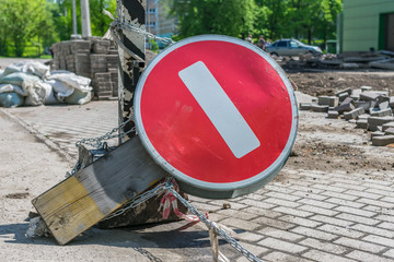 Inverted road sign chained to a pole during road repair. Dead End Warning Road Sign
