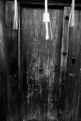 The door's temple.
Black and white picture of a rough wooden door of a temple in Kyoto, Japan.