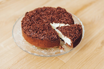 Chocolate Cake. Cottage cheese cheesecake inside. Piece of cake.