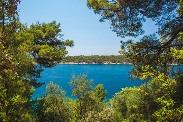 Fototapeta na wymiar Views of coastline from Komrcar city park in Rab town on Rab island, Croatia