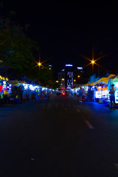 A night neon street at Ben Thanh market in Ho Chi Minh Vietnam wide shot