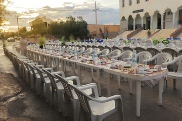 Muslim people eating food during Iftar at home. Traditional evening meal for Ramadan. The Islamic Halal Eating and Drinking