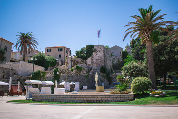 Fototapeta premium Rab town square on Rab island on a cloudless summer day, in Croatia