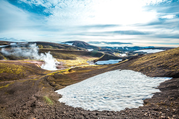 Pools of boiling water and snow in the mountains on the 54 km trek from Landmannalaugar, Iceland