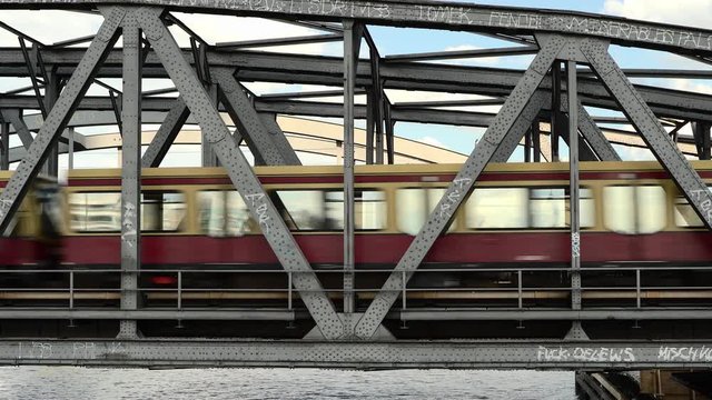 S-Bahn train going by over a bridge in Berlin in summer