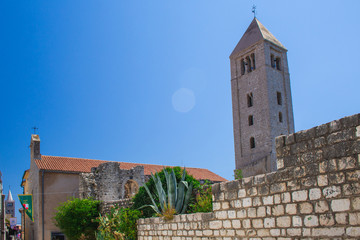 Fototapeta na wymiar Bell tower of the Benedictine Monastery of St. Andrew in Rab town on Rab island, Croatia