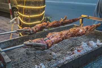 Grilled crocodile on the open fire at sea food restaurant, exotic meals in Viethnam, food of the...
