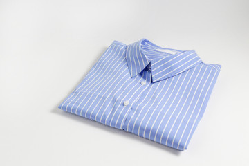 One perfectly folded buttoned shirt with striped pattern. Single piece of formal wear with blank...