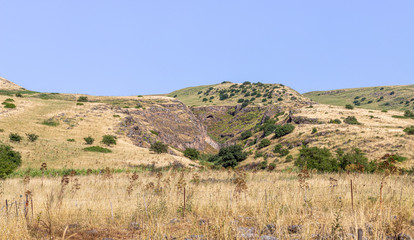 Fototapeta na wymiar Fields turning into hills on the Golan Heights in northern Israel
