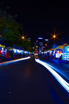 A night neon street at Ben Thanh market in Ho Chi Minh Vietnam wide shot