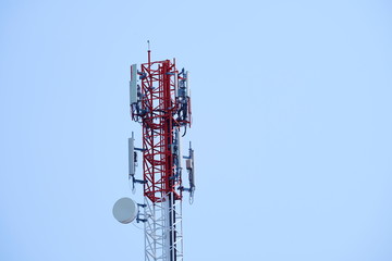 Telecommunication tower of 4G and 5G cellular. Macro Base Station. Wireless Communication Antenna Transmitter. Telecommunication tower with antennas against blue sky background.