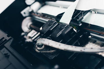 Close-up Interior of printer showing continuous ink system in printer with head system. Professional printer maintenance concept. Technical support in office hardware 