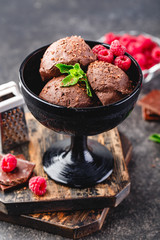 Three brown chocolate ice cream balls