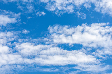 Clear blue sky with white clouds.