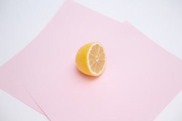 Cut lemon on pink background