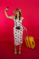 Pretty russian tourist taking selfie in studio