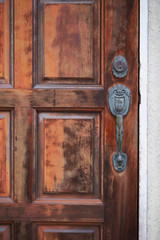 Rusty wooden door wit metal handle