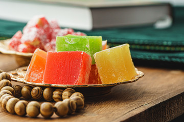 Turkish delight sweets on a metal oriental plate close up