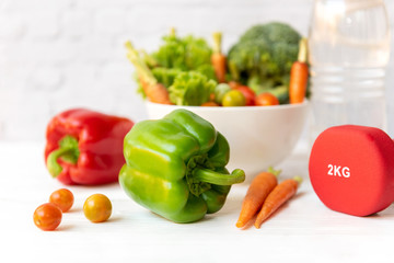 Diet Healthy food and lifestyle health concept. Sport exercise equipment workout and gym background with nutrition detox salad for fitness style. Healthy Concept.