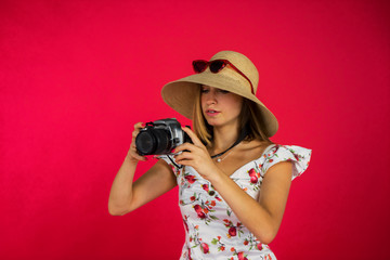 Woman taking picture with digital camera