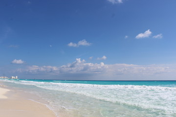 Beach with blue sky and water