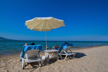beach chairs and umbrella on the beach