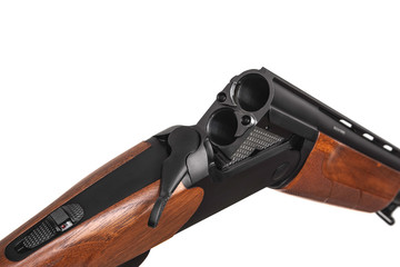 Classic vertical double-barreled hunting rifle isolate on a white back. Smoothbore weapon with a...