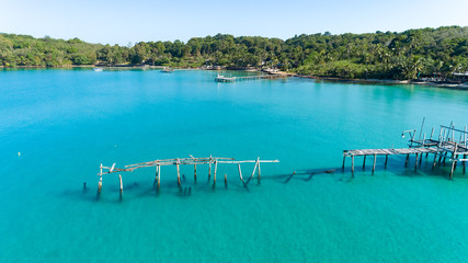Aerial drone of old broken wooden pier at Bang Bao Bay on tropical island Koh Kood, Thailand