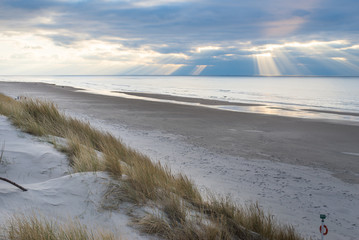 beach in mystical weather at the north sea with fantastic heavenly spectacle