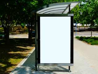 composite image of blank bus shelter and bus stop. glass and aluminum frame structure. urban park...